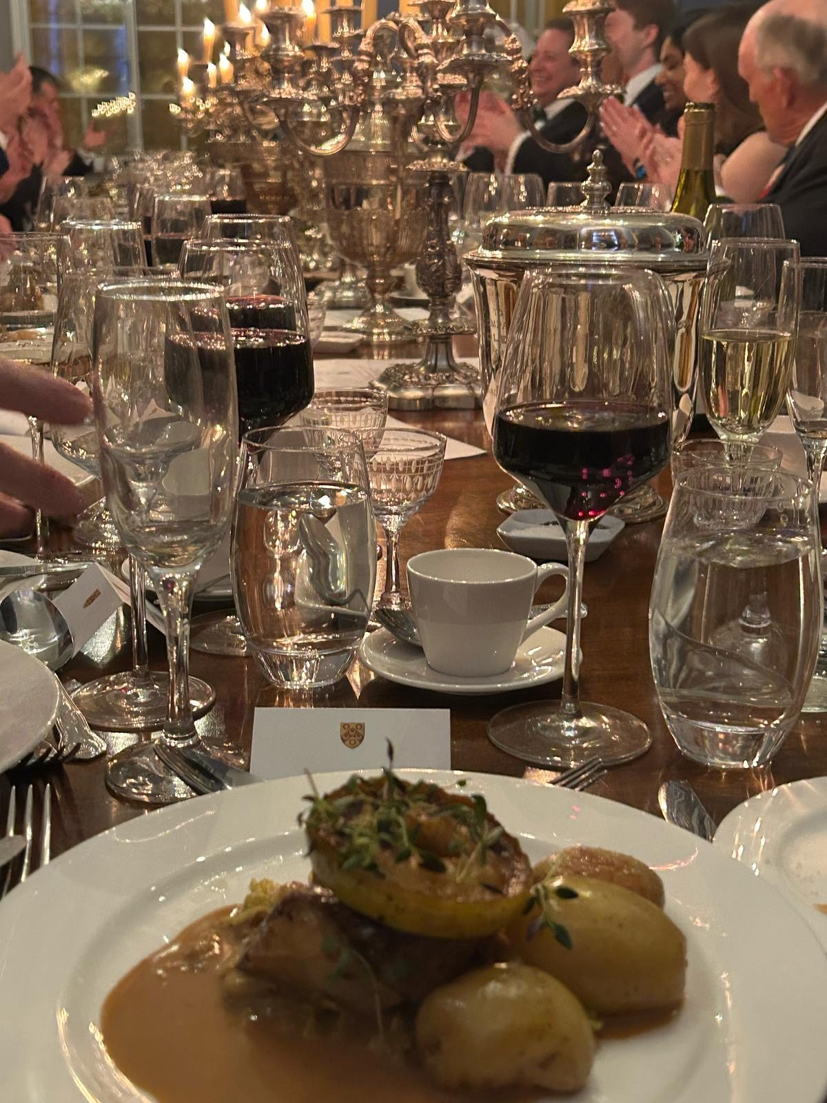 The main course served at the Lodge table, with the Lodge place card and wine